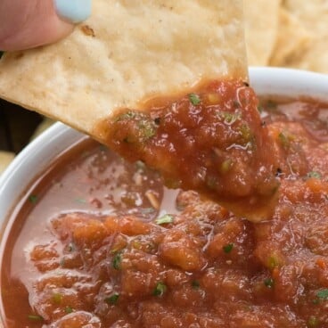 chip being dipped in easy salsa recipe