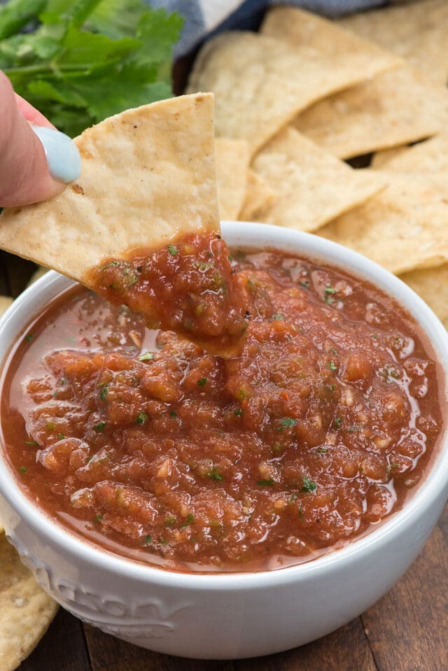 salsa in white bowl on chip