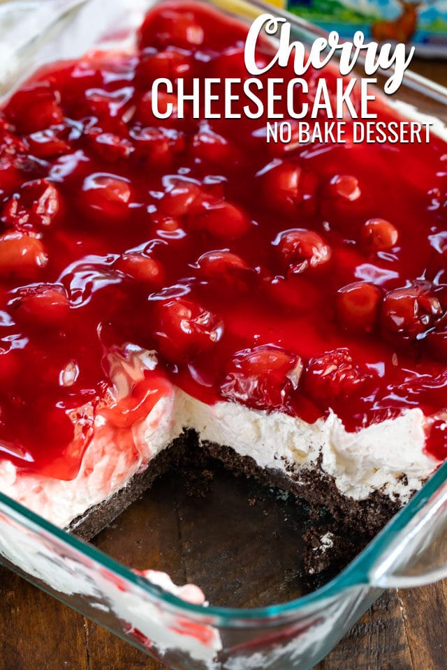 overhead shot of no bake cherry cheesecake dessert in pan with slice missing