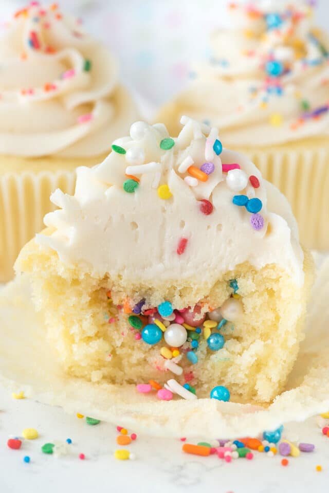 piñata cupcake with half missing and sprinkles