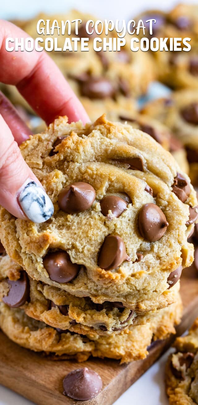 hand holding giant chocolate chip cookie