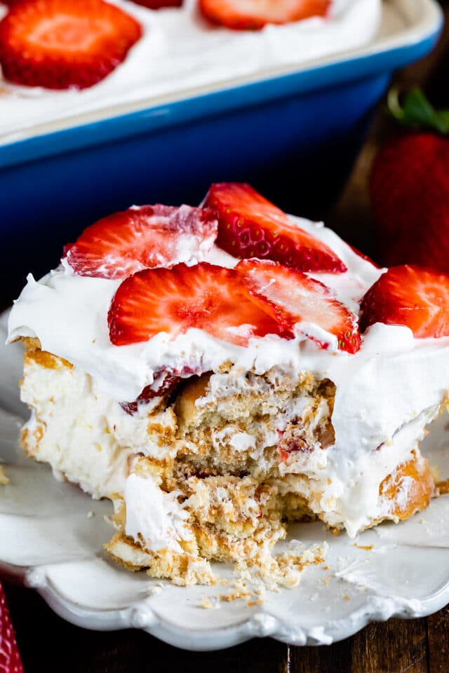 slice of strawberry shortcake icebox cake with bite missing