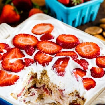 strawberry shortcake icebox cake in pan with slice missing