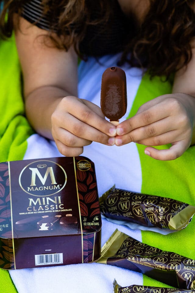 girl holding ice cream bar