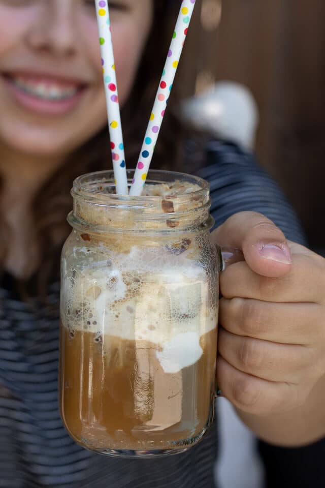 girl holding root beer float