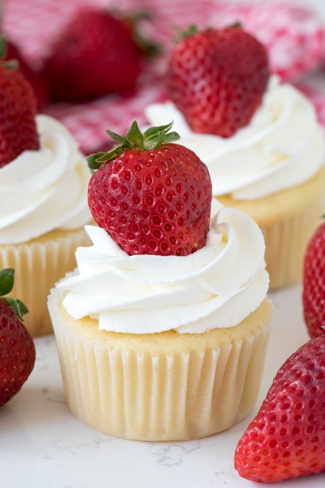 cupcake with whipped cream and strawberry