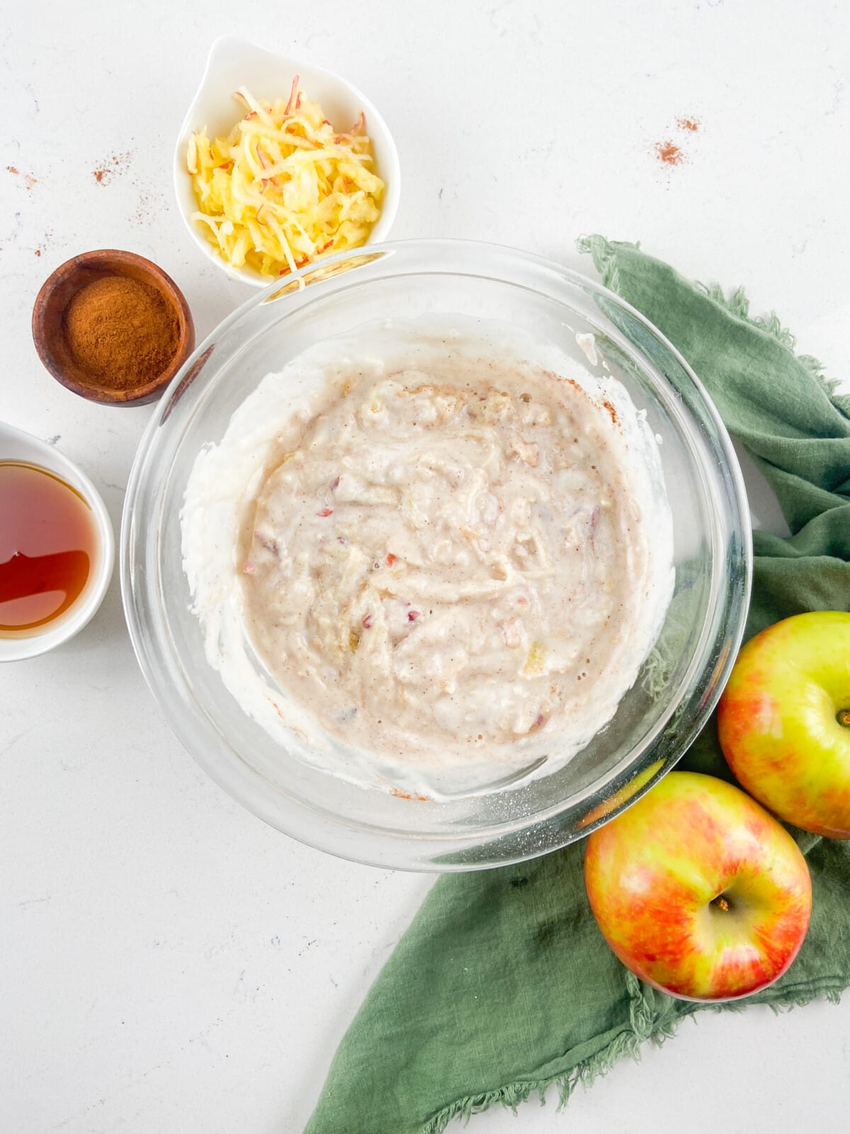 pancake batter with cinnamon and apples.