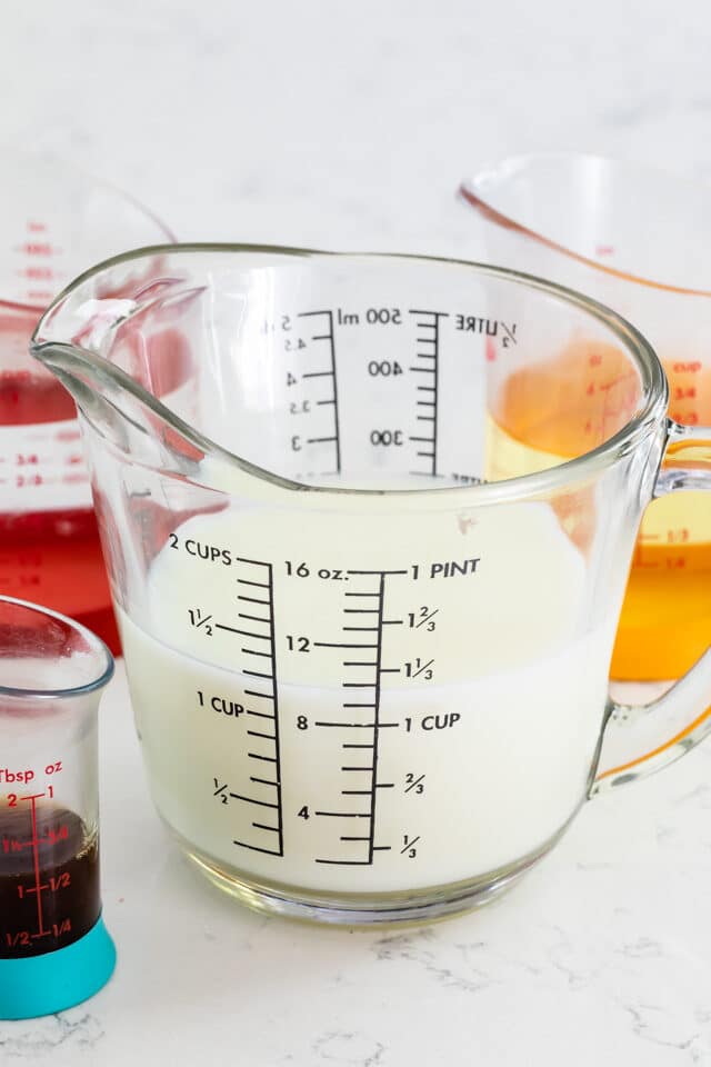 Measuring cup with milk poured in it