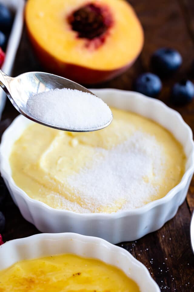 sprinkling sugar on creme brÃ»lÃ©e 