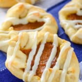 crescent roll with pumpkin inside and drizzle