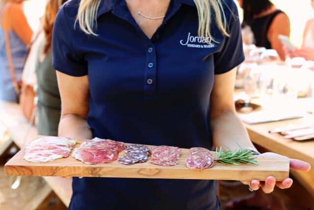 woman holding charcuterie tray