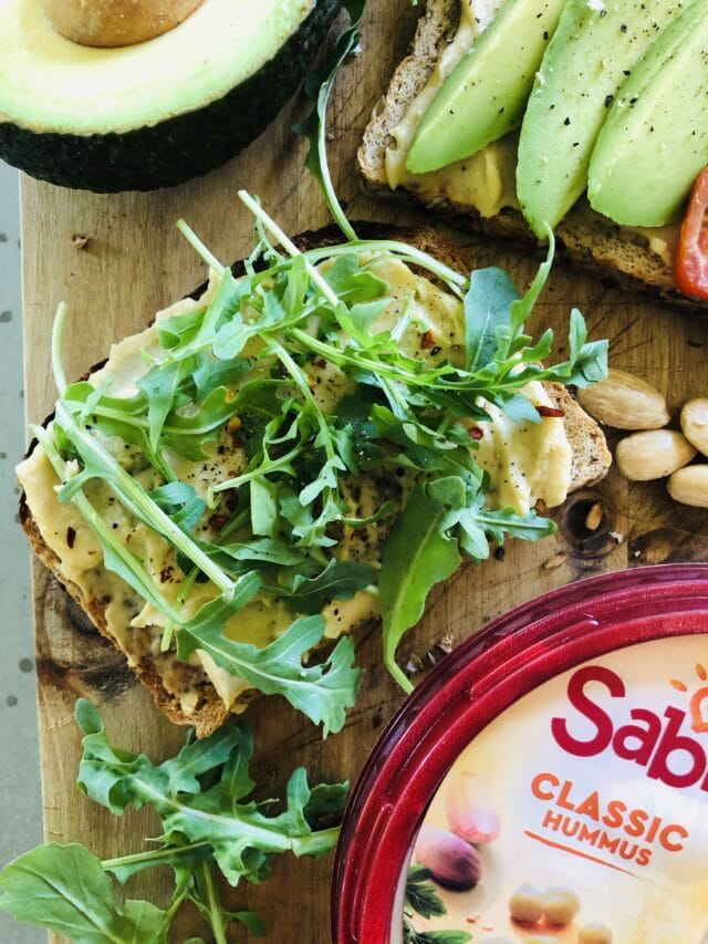 Hummus Toast with plain Sabra Hummus and arugula with pepper.