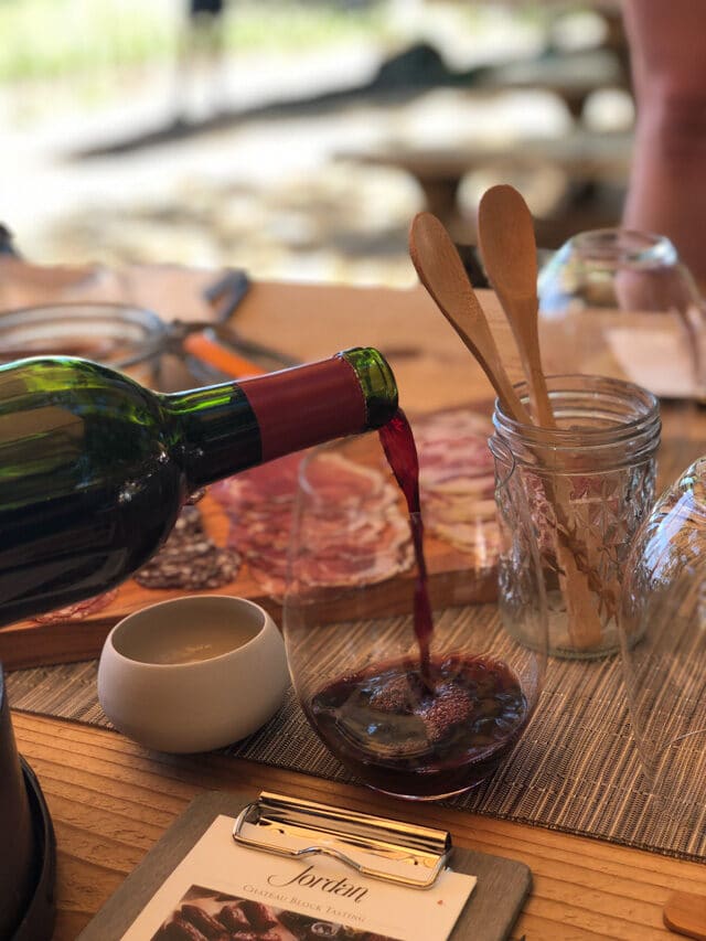 Red wine being poured into a glass