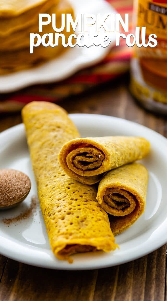 3 pumpkin pancake rolls on white plate