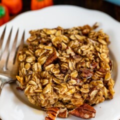 slice of pumpkin spice baked oatmeal on white plate