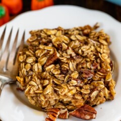 slice of pumpkin spice baked oatmeal on white plate