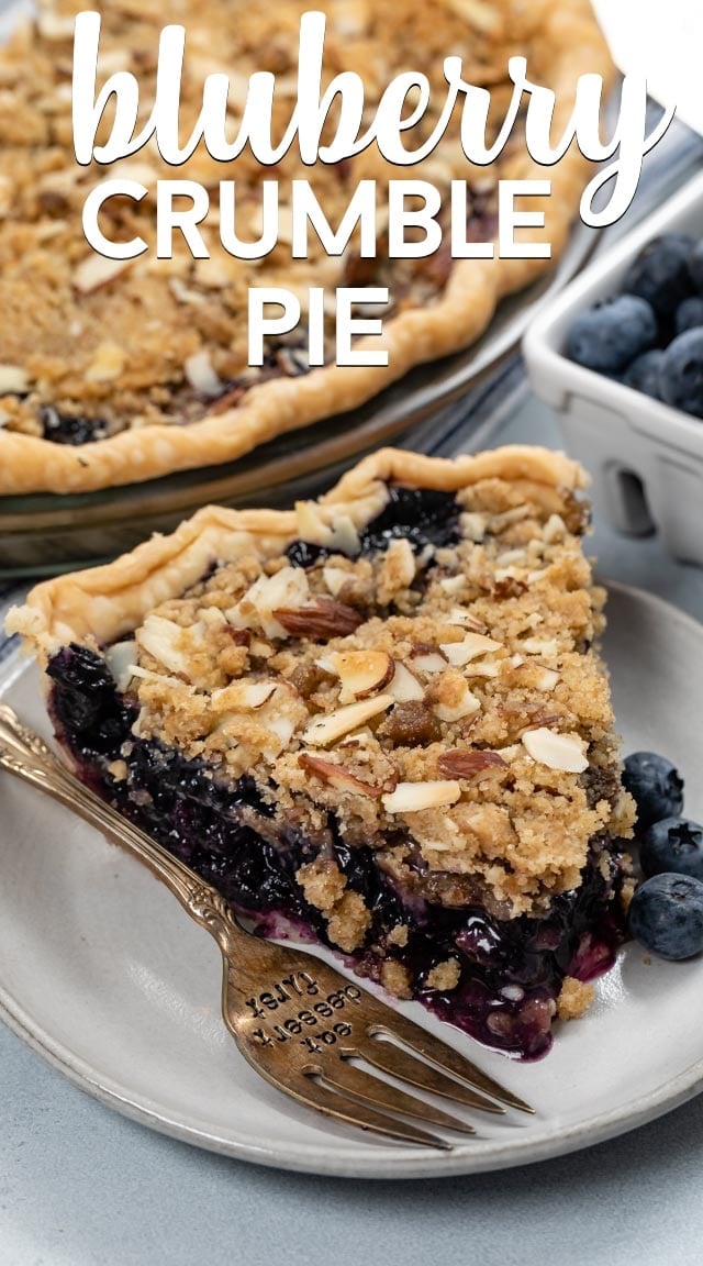 slice of blueberry crumble pie on white plate