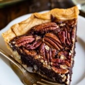 slice of chocolate pecan pie on plate