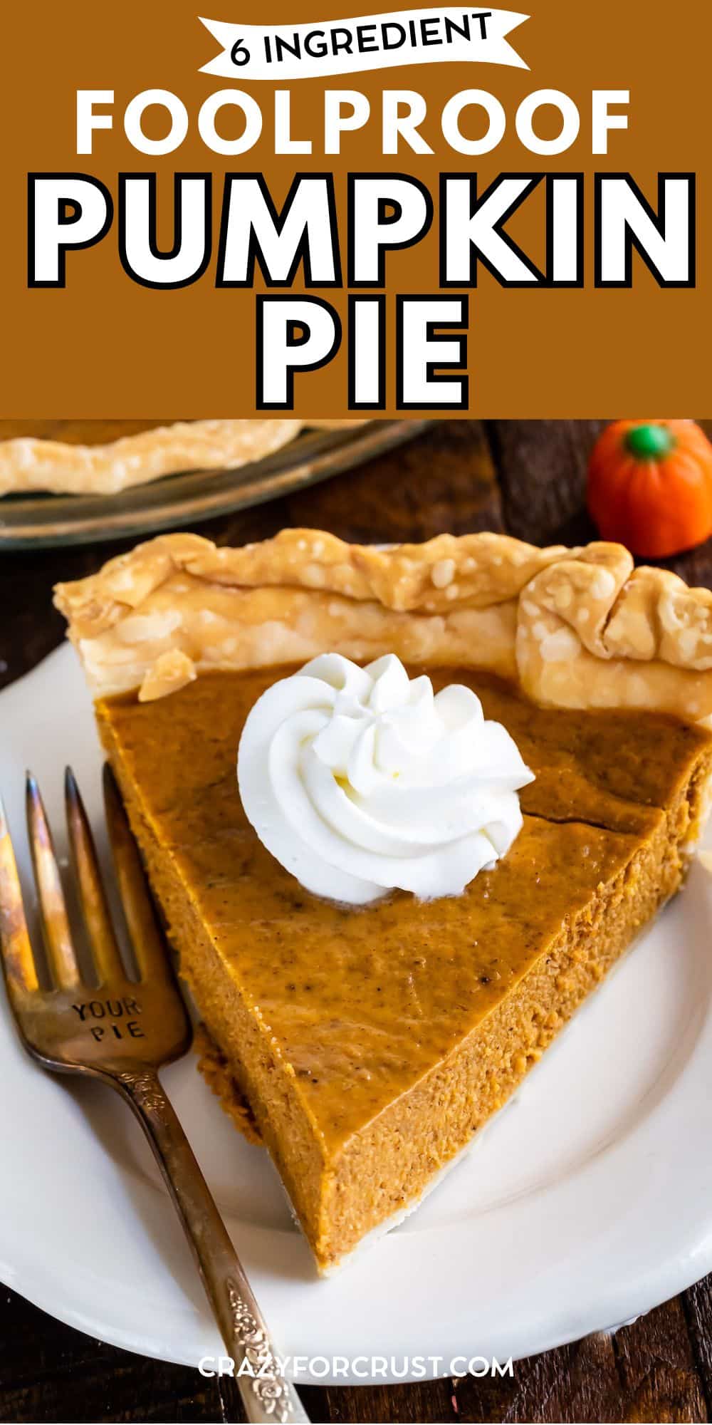 A slice of easy pumpkin pie with a dollop of whipped cream sits on a white plate beside a fork. The pie has a golden, flaky crust, and another slice and a small pumpkin are in the background. Text reads 6 Ingredient Foolproof Pumpkin Pie.
