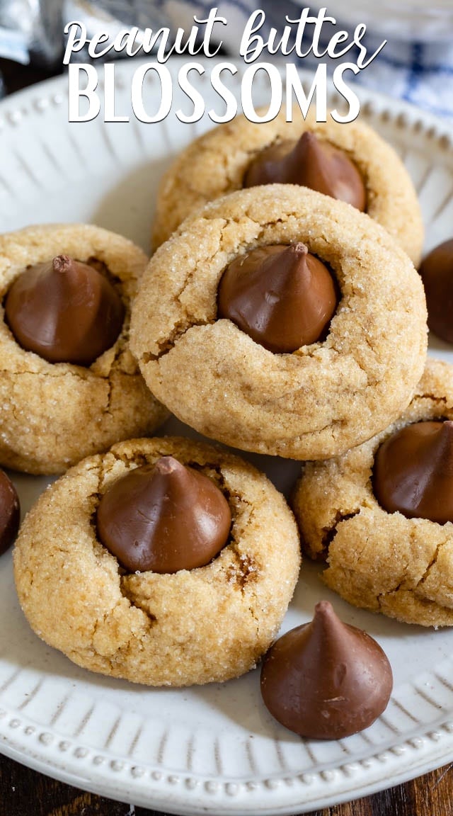 stack of peanut butter blossoms on white plate