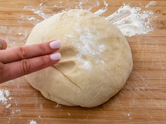 two fingers and cinnamon roll dough
