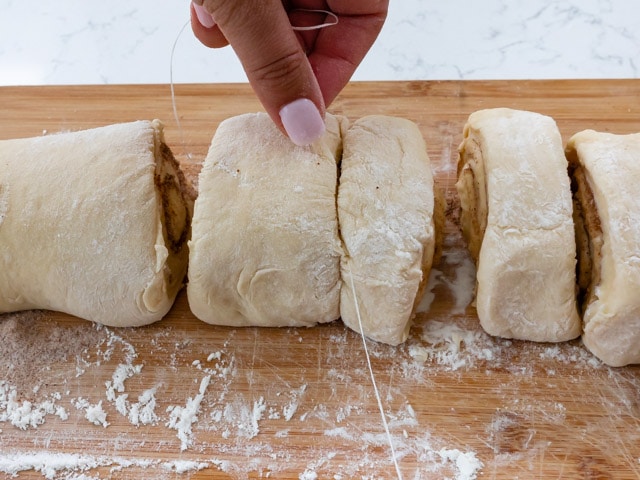 slice cinnamon rolls with dental floss