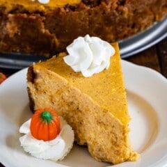 slice of pumpkin cheesecake on white plate