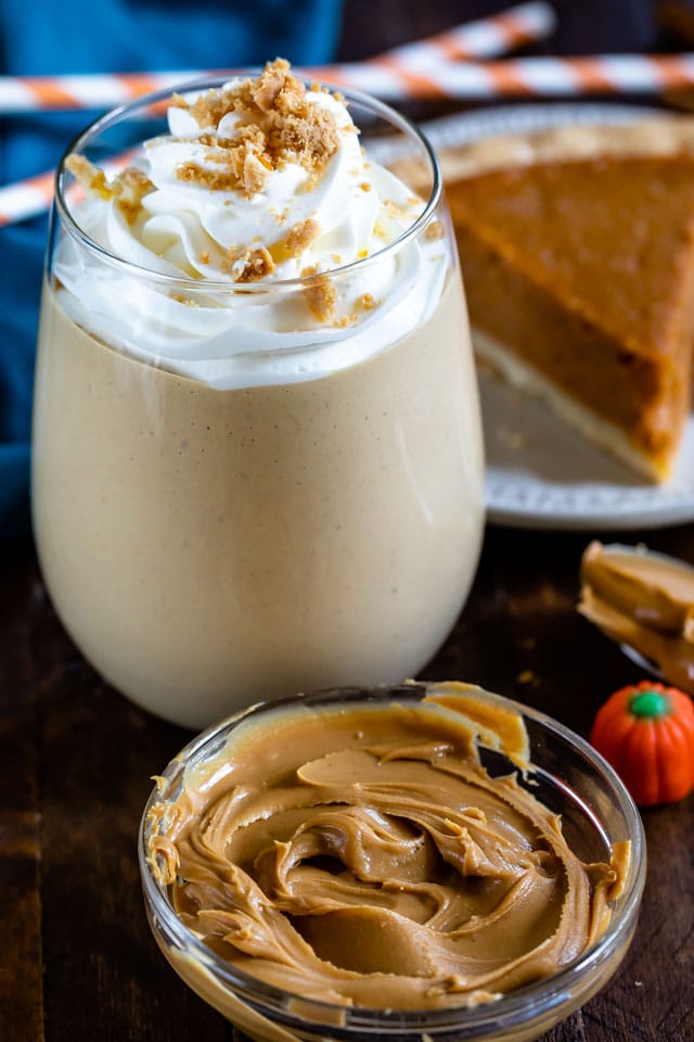 peanut butter smoothie in glass with whipped cream