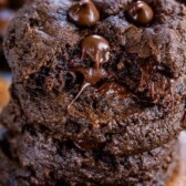 stack of double chocolate chip cookies with bite missing