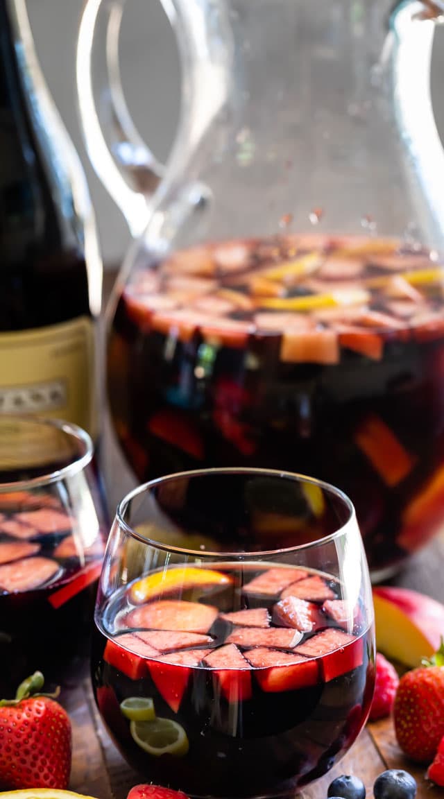 red sangria in glass and pitcher