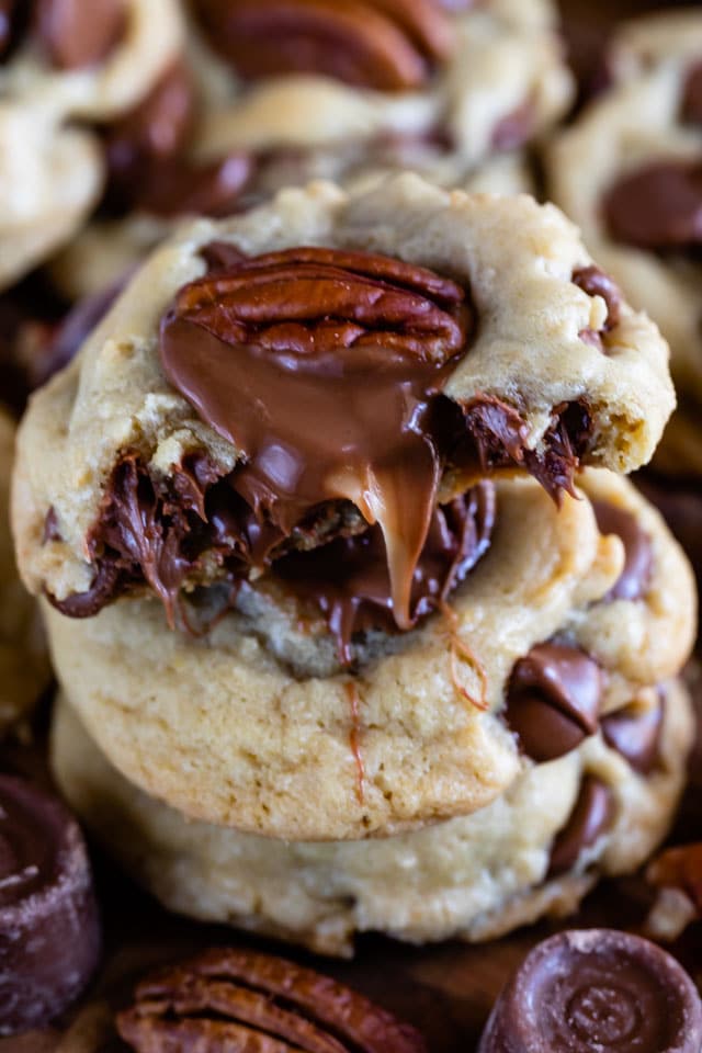 half of a cookie with gooey caramel