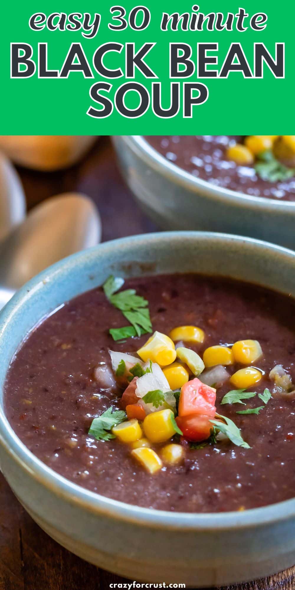 soup in blue bowl with corn on top.