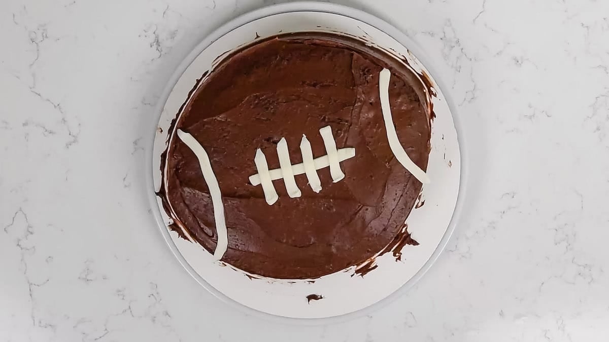 cake on board decorated like football