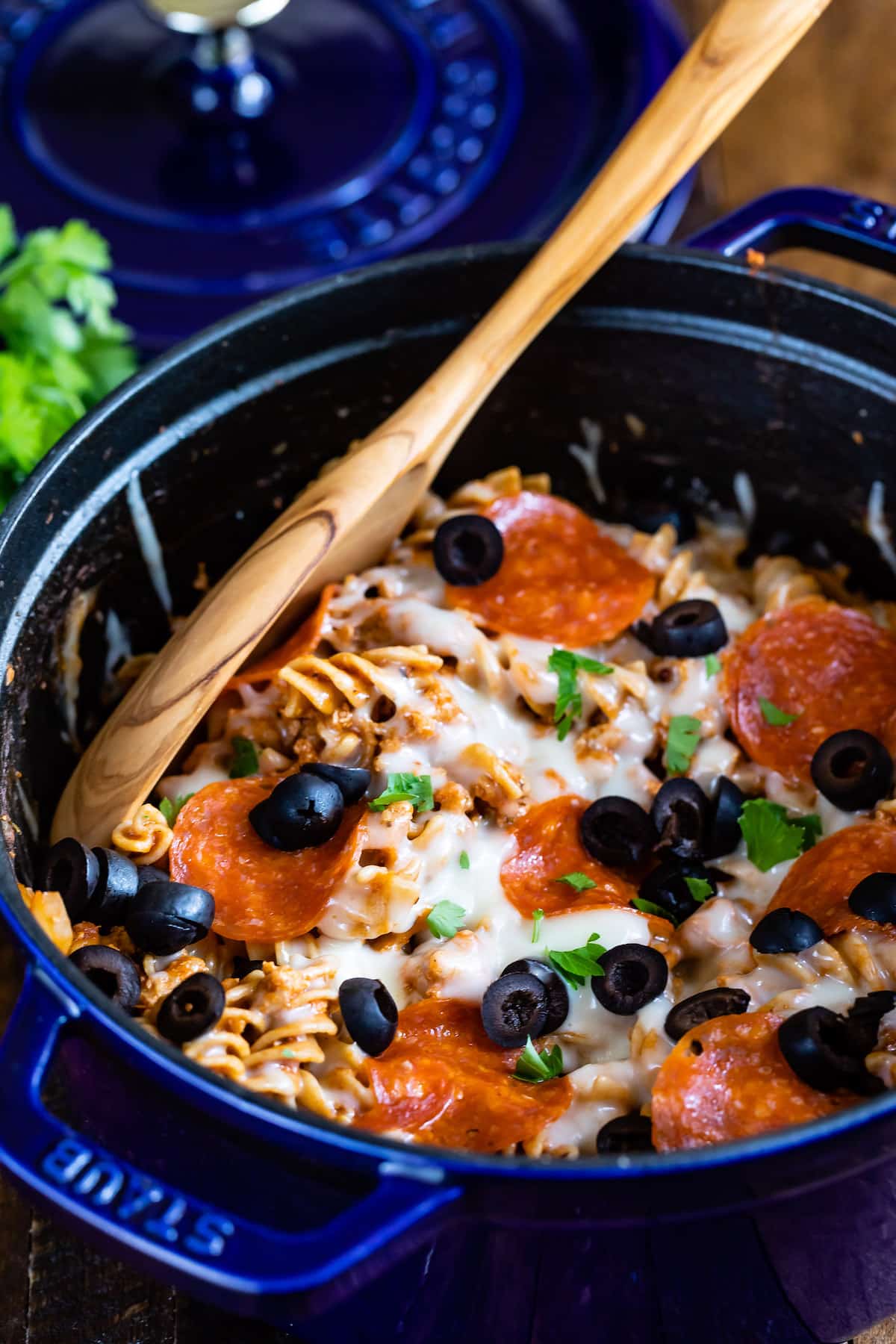 photo showing pasta in blue pot with pizza toppings