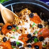 photo showing pasta in blue pot with pizza toppings