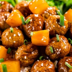 close up of teriyaki meatballs with pineapple on rice