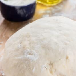 pizza dough on cutting board