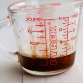 measuring cup with brown butter in it