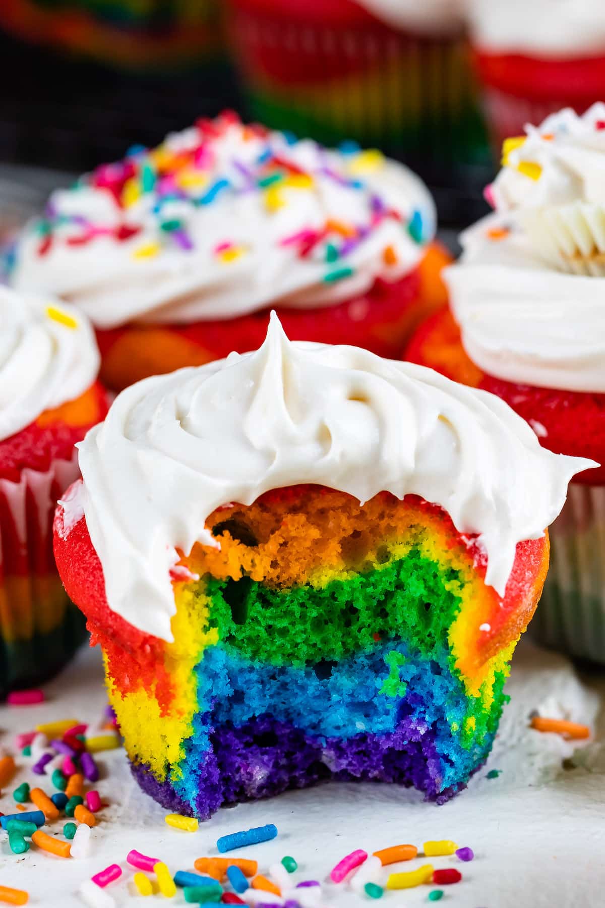 rainbow cupcake with bite missing
