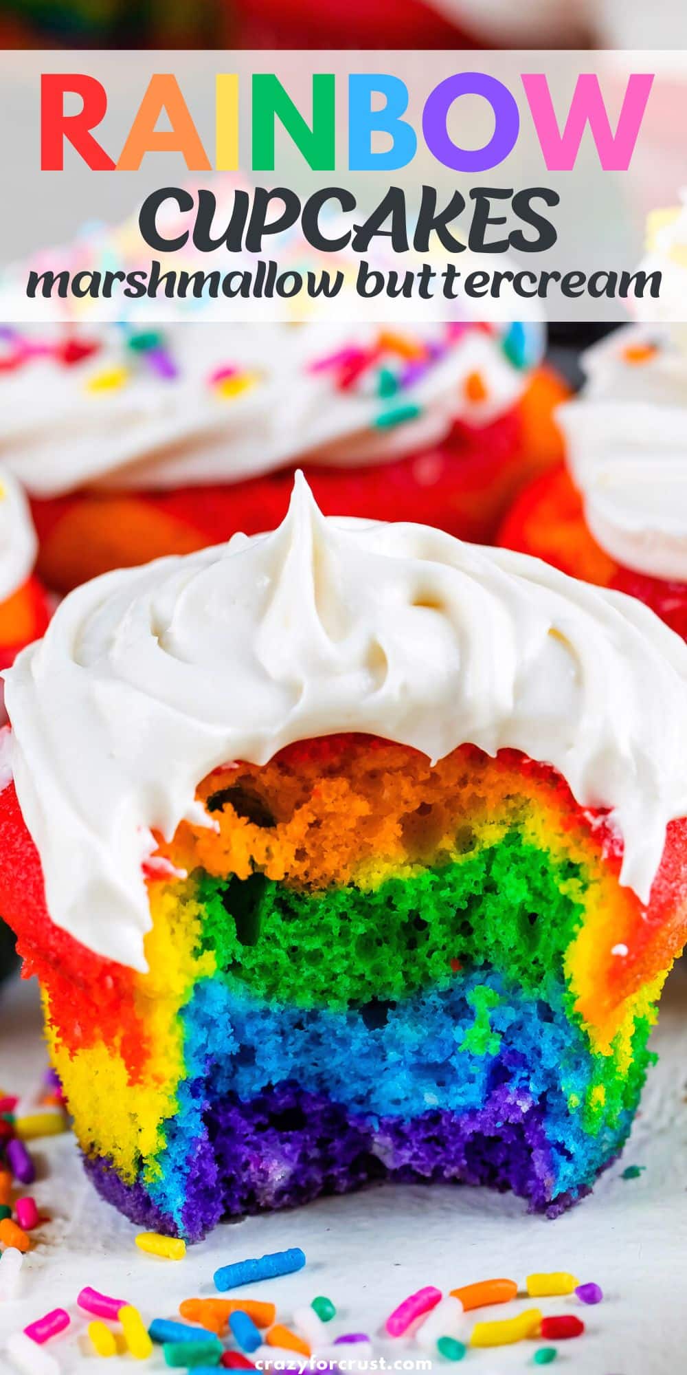 rainbow cupcake with bite missing.