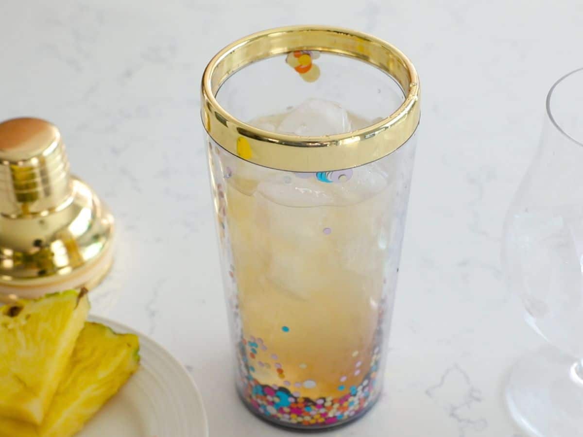 cocktail shaker with mai tai inside.