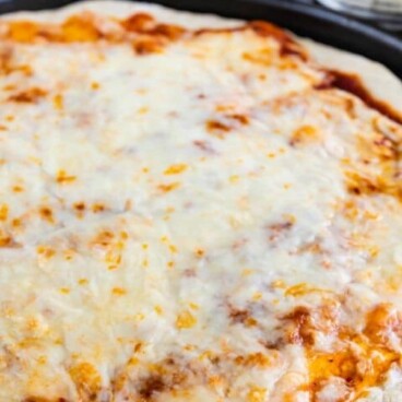 Quick pizza crust with cheese on pan