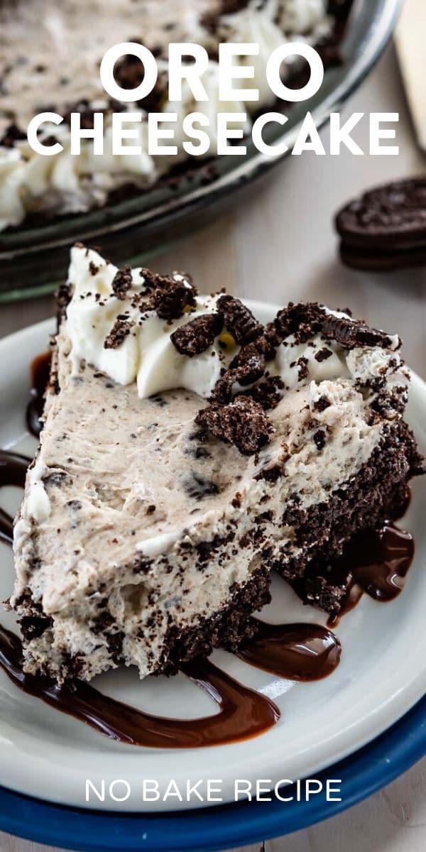 slice of oreo cheesecake on white plate with hot fudge