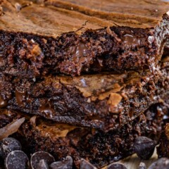 Stack of three brown butter brownies with chocolate chips