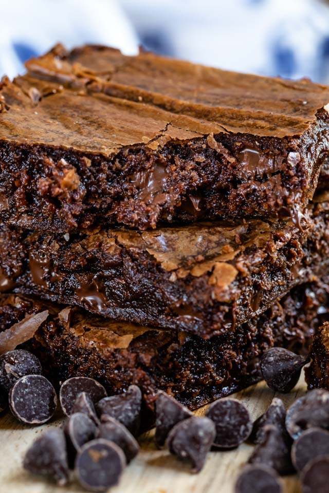 Stack of three brown butter brownies with chocolate chips make the best brownie recipe