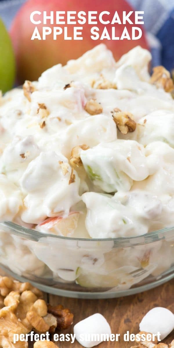 Close up shot of cheesecake apple salad in a clear bowl with ingredients at the bottom and recipe title at top of photo