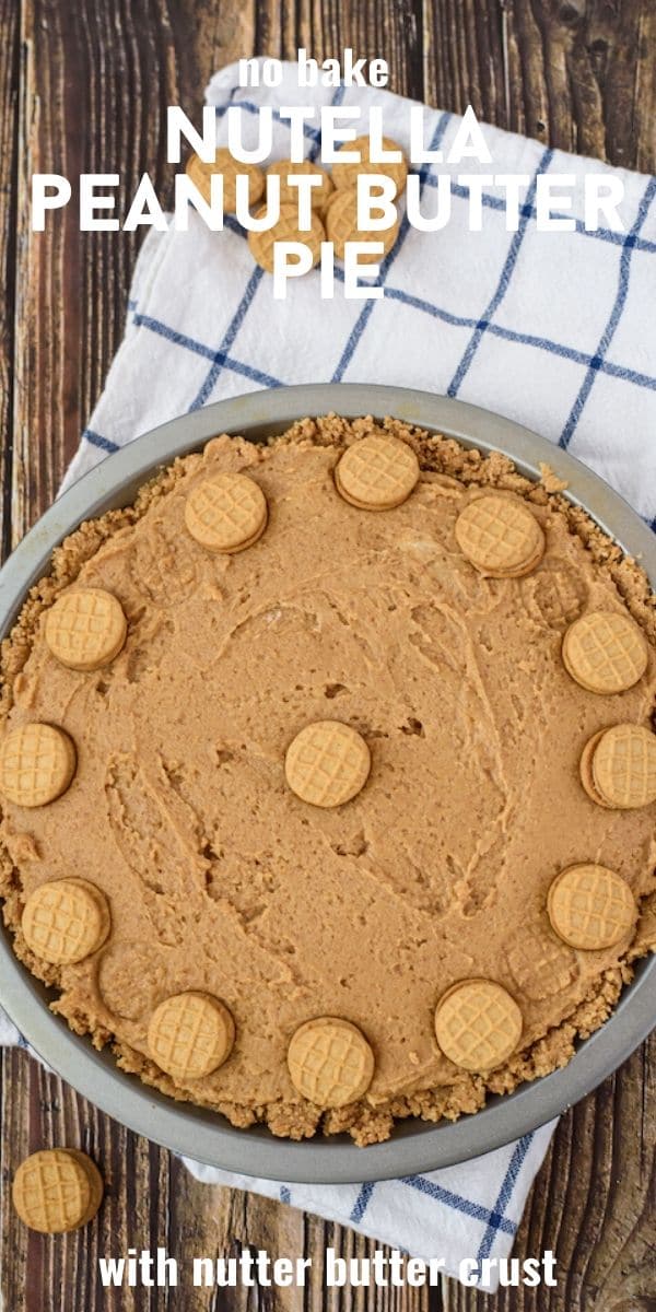 Overhead shot of nutella peanut butter pie on a wood table with blue and white checkered napkin with recipe title at top of photo