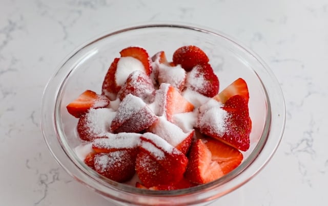 strawberries in bowl with sugar