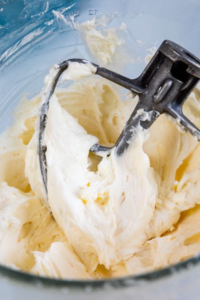 Vanilla buttercream icing in a bowl with paddle attachment