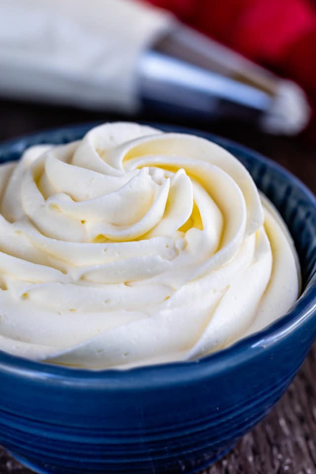 Close up shot of whipped cream frosting in a blue dish